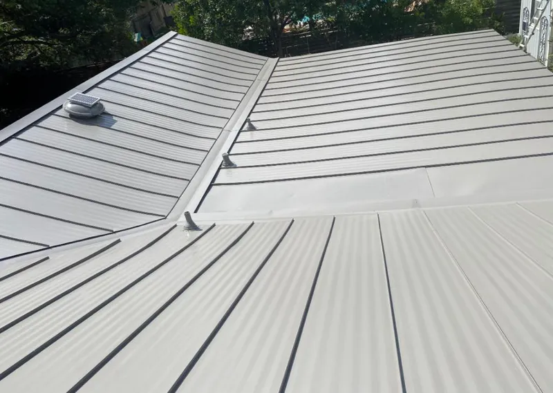 Solar attic fan installed on a metal roof for Roof Ventilation in Natchez